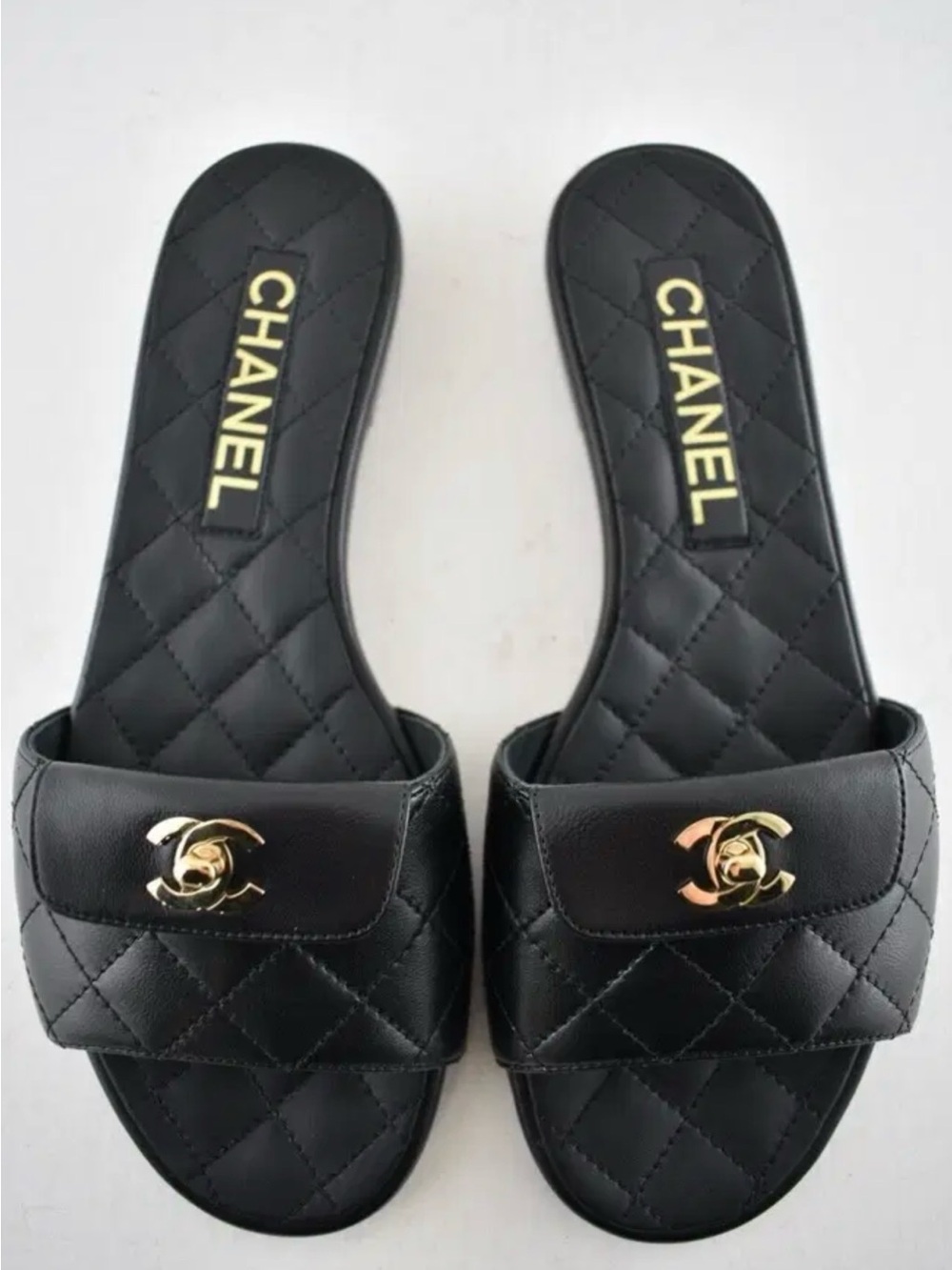 CHANEL 26 Black Quilted Leather Slide Mules with Gold CC Hardware